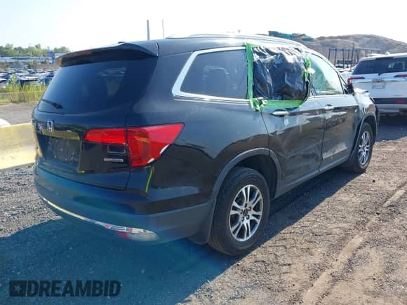 2017 Honda Pilot Touring with VIN 5FNYF5H98HB002514, listed as a IAAI auction lot 42954277 with 167,944 mi miles and . Bid and sale history available at DreamBid. Image 4.