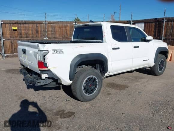 2024 Toyota Tacoma SR5 with VIN 3TYLB5JN9RT004030, listed as a IAAI auction lot 43486815 with 27,397 mi miles and . Bid and sale history available at DreamBid. Image 4.