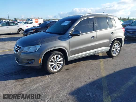2011 Volkswagen Tiguan SE with VIN WVGAV7AX5BW548176, listed as a IAAI auction lot 41549614 with 134,708 mi miles and . Bid and sale history available at DreamBid. Image 2.
