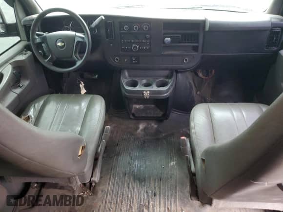 2014 Chevrolet Express Passenger 1LS with VIN 1GAZGZFAXE1105162, listed as a Copart auction lot 72773154 with 97,950 mi miles and Salvage title. Bid and sale history available at DreamBid. Image 8.
