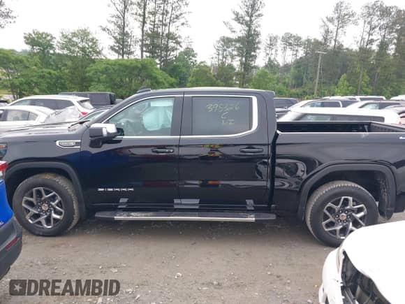 2024 GMC Sierra 1500 SLE with VIN 1GTUUBEDXRZ395326, listed as a IAAI auction lot 42210609 with 185 mi miles and . Bid and sale history available at DreamBid. Image 14.