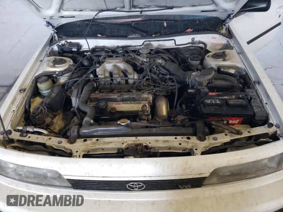 1991 Toyota Camry z VIN 4T1VV21E8MU050409, wystawiony jako Copart lot #61379824 z przebiegiem 100 949 mil mil oraz Nie do naprawy • Non repairable. Historia ofert i sprzedaży dostępna na DreamBid. Obrazek 11.