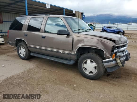 1997 Chevrolet Tahoe с VIN 1GNEK13R0VJ415280, выставлен на аукционе Copart как лот 80546475 с пробегом 163 092 миль миль и Списание • Salvage title. История ставок и продаж доступна на DreamBid. Изображение 4.