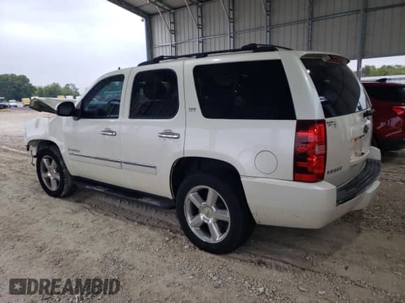 2009 Chevrolet Tahoe LTZ with VIN 1GNFK33059R291256, listed as a Copart auction lot 82418965 with 220,573 mi miles and Salvage title. Bid and sale history available at DreamBid. Image 2.
