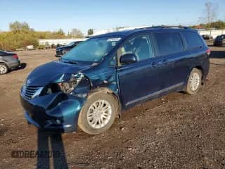 2012 Toyota Sienna XLE with VIN 5TDYK3DC5CS245235, listed as a Copart auction lot 82349425 with 149,275 mi miles and Salvage title. Bid and sale history available at DreamBid. Image 1.
