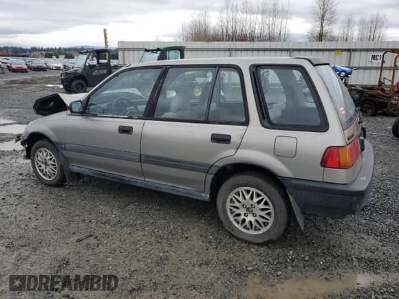 1990 Honda Civic with VIN JHMEE2754LS010638, listed as a Copart auction lot 85169464 with 167,566 mi miles and Salvage title. Bid and sale history available at DreamBid. Image 2.