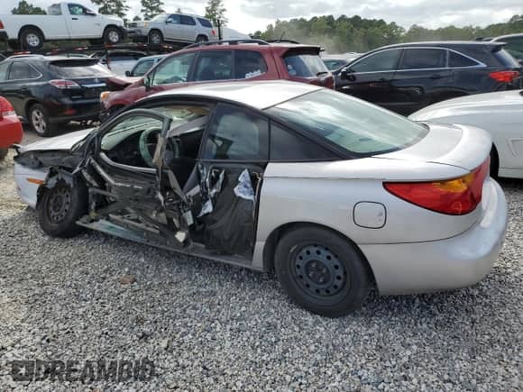 2001 Saturn SC with VIN 1G8ZP12851Z215716, listed as a Copart auction lot 69665754 with Not provided miles and Salvage title. Bid and sale history available at DreamBid. Image 2.