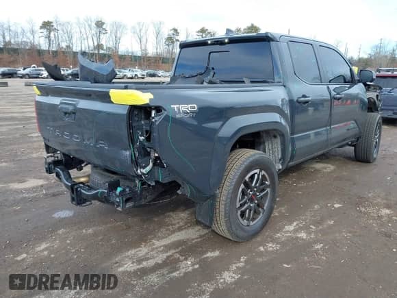 2024 Toyota Tacoma SR5 with VIN 3TYLB5JN1RT039046, listed as a IAAI auction lot 41610499 with 6,455 mi miles and . Bid and sale history available at DreamBid. Image 4.