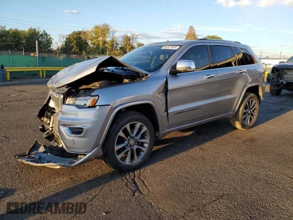 2017 Jeep Grand Cherokee Overland with VIN 1C4RJFCGXHC756588, listed as a Copart auction lot 84282675 with 101,960 mi miles and Salvage title. Bid and sale history available at DreamBid. Image 1.