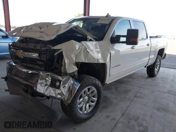 2016 Chevrolet Silverado 2500HD LT z VIN 1GC1KVE88GF247168, wystawiony jako IAAI lot #40907712 z przebiegiem Nie podano mil oraz . Historia ofert i sprzedaży dostępna na DreamBid. Obrazek 2.
