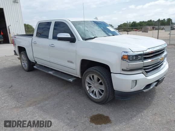 2017 Chevrolet Silverado 1500 High Country z VIN 3GCUKTECXHG309062, wystawiony jako IAAI lot #42560582 z przebiegiem 135 060 mil mil oraz . Historia ofert i sprzedaży dostępna na DreamBid. Obrazek 1.