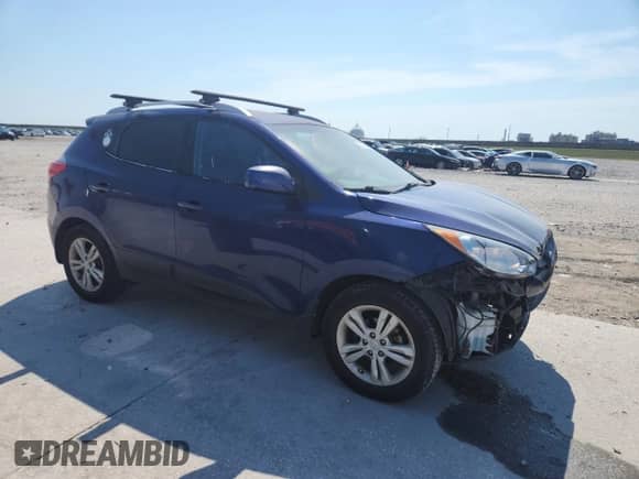 2011 Hyundai Tucson GLS with VIN KM8JU3AC3BU124953, listed as a Copart auction lot 70328355 with 150,166 mi miles and Salvage title. Bid and sale history available at DreamBid. Image 4.