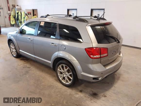 2015 Dodge Journey R/T with VIN 3C4PDDFG2FT715808, listed as a IAAI auction lot 42415079 with 165,828 mi miles and . Bid and sale history available at DreamBid. Image 3.