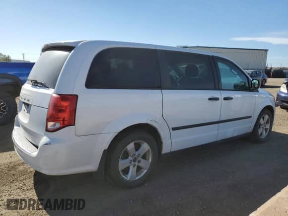 2014 Dodge Grand Caravan American Value with VIN 2C4RDGBG1ER100605, listed as a Copart auction lot 82104405 with 192,277 mi miles and Salvage title. Bid and sale history available at DreamBid. Image 3.