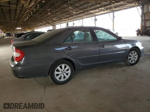 2004 Toyota Camry XLE z VIN 4T1BE32K84U893071, wystawiony jako Copart lot #85852435 z przebiegiem 172 814 mil mil oraz Szkoda całkowita • Salvage title. Historia ofert i sprzedaży dostępna na DreamBid. Obrazek 3.