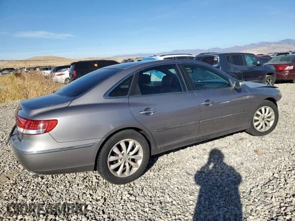 2007 Hyundai Azera SE с VIN KMHFC46F37A173080, выставлен на аукционе Copart как лот 77492564 с пробегом 185 542 миль миль и Списание • Salvage title. История ставок и продаж доступна на DreamBid. Изображение 3.
