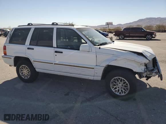 1995 Jeep Grand Cherokee Limited with VIN 1J4GZ78Y3SC701103, listed as a Copart auction lot 72038184 with 143,829 mi miles and Salvage title. Bid and sale history available at DreamBid. Image 4.