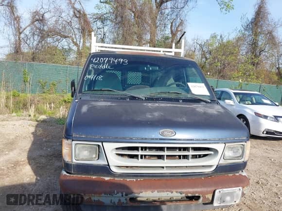 2002 Ford Econoline Cargo with VIN 1FTRE142X2HA67221, listed as a IAAI auction lot 42079493 with 180,324 mi miles and . Bid and sale history available at DreamBid. Image 6.