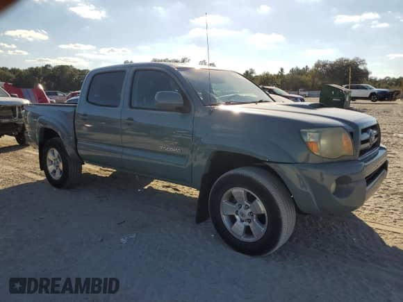 2009 Toyota Tacoma PreRunner with VIN 3TMJU62N19M087972, listed as a Copart auction lot 89497165 with 191,755 mi miles and Salvage title. Bid and sale history available at DreamBid. Image 4.