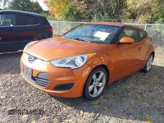 2012 Hyundai Veloster w/Red Int z VIN KMHTC6AD8CU065650, wystawiony jako IAAI lot #43576272 z przebiegiem 147 621 mil mil oraz . Historia ofert i sprzedaży dostępna na DreamBid. Obrazek 2.