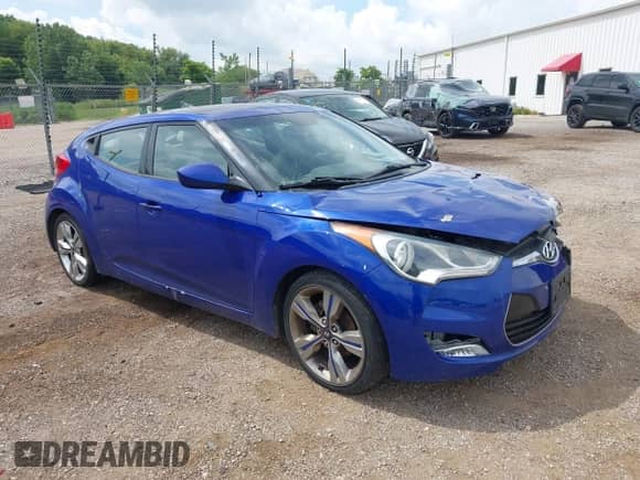 2012 Hyundai Veloster w/Black Int z VIN KMHTC6AD9CU054320, wystawiony jako IAAI lot #42750083 z przebiegiem 130 343 mil mil oraz . Historia ofert i sprzedaży dostępna na DreamBid. Obrazek 1.