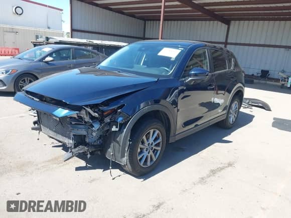 2023 Mazda CX-5 S Carbon Edition z VIN JM3KFBCMXP0282649, wystawiony jako IAAI lot #42784337 z przebiegiem 25 589 mil mil oraz . Historia ofert i sprzedaży dostępna na DreamBid. Obrazek 2.