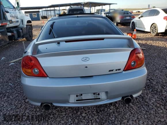 2004 Hyundai Tiburon GT с VIN KMHHN65F44U130202, выставлен на аукционе Copart как лот 43193404 с пробегом 207 694 миль миль и Списание • Salvage title. История ставок и продаж доступна на DreamBid. Изображение 6.