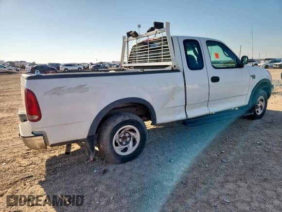 2000 Ford F-150 XL with VIN 1FTRX18W8YNC33964, listed as a Copart auction lot 62923725 with 243,301 mi miles and Salvage title. Bid and sale history available at DreamBid. Image 3.