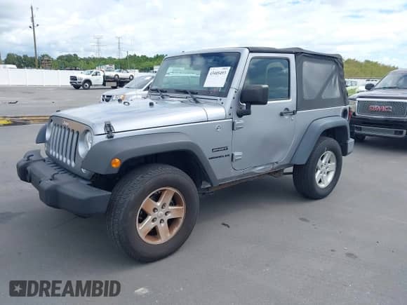 2016 Jeep Wrangler Willys Wheeler z VIN 1C4AJWAG1GL327242, wystawiony jako IAAI lot #43405493 z przebiegiem Nie podano mil oraz . Historia ofert i sprzedaży dostępna na DreamBid. Obrazek 2.