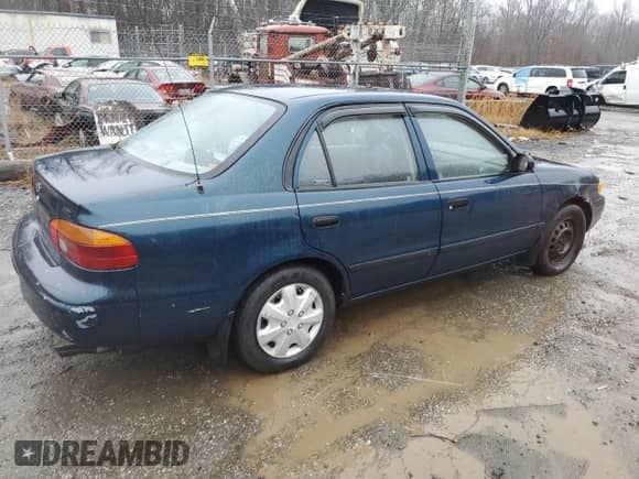 2000 Chevrolet Prizm с VIN 1Y1SK528XYZ418233, выставлен на аукционе Copart как лот 83036344 с пробегом Не указан миль и Списание • Salvage title. История ставок и продаж доступна на DreamBid. Изображение 3.