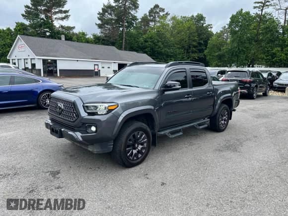 2022 Toyota Tacoma Limited с VIN 3TMGZ5AN7NM458988, выставлен на аукционе Copart как лот 65398105 с пробегом 32 115 миль миль и Списание • Salvage title. История ставок и продаж доступна на DreamBid. Изображение 2.