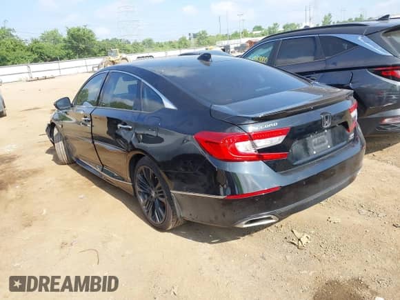 2018 Honda Accord Touring with VIN 1HGCV2F97JA027967, listed as a IAAI auction lot 42704991 with 86,116 mi miles and . Bid and sale history available at DreamBid. Image 3.