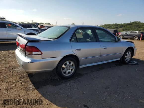 2002 Honda Accord EX with VIN 1HGCG56692A038763, listed as a Copart auction lot 71771595 with 158,801 mi miles and Salvage title. Bid and sale history available at DreamBid. Image 3.