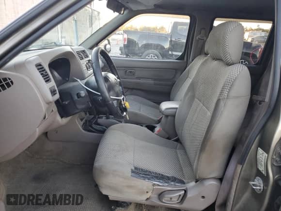 2001 Nissan Frontier SE with VIN 1N6ED27Y81C357537, listed as a Copart auction lot 77595894 with 202,092 mi miles and Salvage title. Bid and sale history available at DreamBid. Image 7.