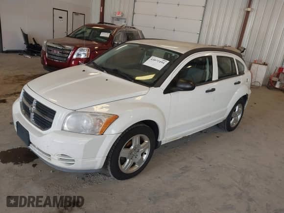 2008 Dodge Caliber SXT with VIN 1B3HB48B48D777684, listed as a IAAI auction lot 43072494 with 186,785 mi miles and . Bid and sale history available at DreamBid. Image 2.