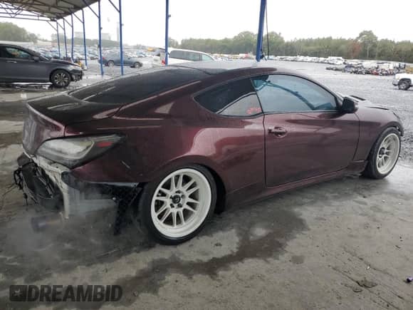2016 Hyundai Genesis Coupe 3.8L Base z VIN KMHHT6KJ0GU135142, wystawiony jako Copart lot #90144965 z przebiegiem 121 891 mil mil oraz Szkoda całkowita • Salvage title. Historia ofert i sprzedaży dostępna na DreamBid. Obrazek 3.