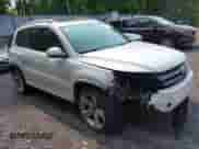 2014 Volkswagen Tiguan SEL with VIN WVGAV3AX7EW022239, listed as a IAAI auction lot 42381670 with 180,729 mi miles and . Bid and sale history available at DreamBid. Image 1.