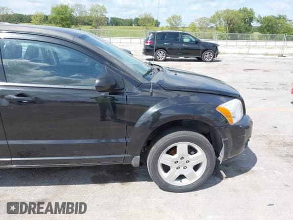 2009 Dodge Caliber SXT with VIN 1B3HB48A59D183646, listed as a IAAI auction lot 43048308 with 152,808 mi miles and . Bid and sale history available at DreamBid. Image 18.