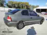 2002 Hyundai Accent GS z VIN KMHCG35C72U192411, wystawiony jako Copart lot #85322524 z przebiegiem 130 977 mil mil oraz Szkoda całkowita • Salvage title. Historia ofert i sprzedaży dostępna na DreamBid. Obrazek 3.