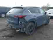 2022 Mazda CX-5 S Carbon Edition z VIN JM3KFBCM2N0529241, wystawiony jako IAAI lot #41708100 z przebiegiem 24 139 mil mil oraz . Historia ofert i sprzedaży dostępna na DreamBid. Obrazek 4.