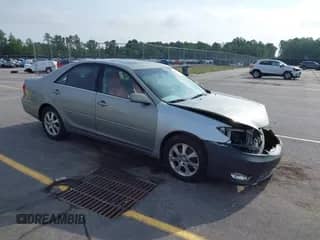 2005 Toyota Camry LE with VIN 4T1BF30K05U596653, listed as a IAAI auction lot 42482189 with 242,939 mi miles and . Bid and sale history available at DreamBid. Image 1.
