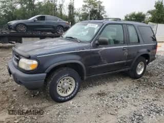 2000 Ford Explorer with VIN 1FMYU60X2YUA76116, listed as a Copart auction lot 84280935 with 90,504 mi miles and Clean title. Bid and sale history available at DreamBid. Image 1.
