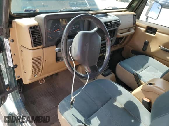 2001 Jeep Wrangler Sahara z VIN 1J4FA59S21P349009, wystawiony jako Copart lot #57588205 z przebiegiem 235 268 mil mil oraz Czysty tytuł • Clean title. Historia ofert i sprzedaży dostępna na DreamBid. Obrazek 8.