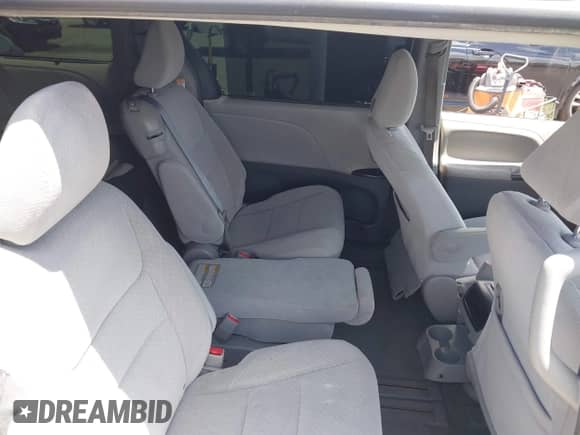 2015 Toyota Sienna LE with VIN 5TDKK3DC6FS664852, listed as a IAAI auction lot 42517486 with 106,951 mi miles and . Bid and sale history available at DreamBid. Image 8.