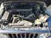 2002 Jeep Wrangler X z VIN 1J4FA39S92P729342, wystawiony jako Copart lot #56130275 z przebiegiem 132 566 mil mil oraz Szkoda całkowita • Salvage title. Historia ofert i sprzedaży dostępna na DreamBid. Obrazek 12.