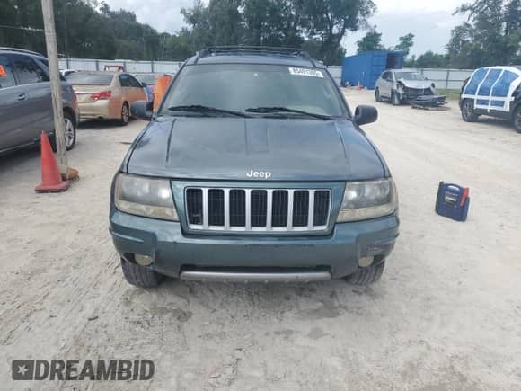 2004 Jeep Grand Cherokee Laredo with VIN 1J4GX48S24C314691, listed as a Copart auction lot 85491395 with 239,637 mi miles and Salvage title. Bid and sale history available at DreamBid. Image 5.