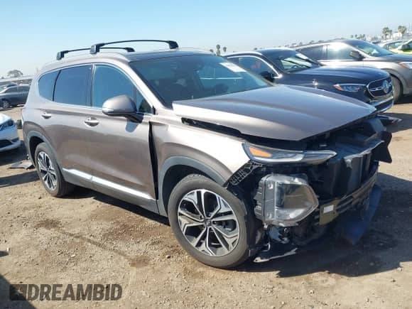 2020 Hyundai Santa Fe SEL z VIN 5NMS33AA2LH216204, wystawiony jako IAAI lot #41851982 z przebiegiem 65 486 mil mil oraz . Historia ofert i sprzedaży dostępna na DreamBid. Obrazek 1.