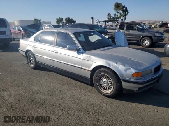 1999 BMW 7 Series 740iL with VIN WBAGH833XXDP05142, listed as a Copart auction lot 74104394 with Not provided miles and Salvage title. Bid and sale history available at DreamBid. Image 4.