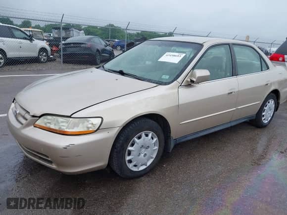 2002 Honda Accord LX with VIN JHMCG56402C025464, listed as a IAAI auction lot 42458693 with 257,711 mi miles and . Bid and sale history available at DreamBid. Image 2.