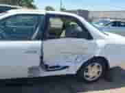 1997 Toyota Camry LE z VIN JT2BF22K6V0052184, wystawiony jako IAAI lot #42608245 z przebiegiem 188 191 mil mil oraz . Historia ofert i sprzedaży dostępna na DreamBid. Obrazek 6.